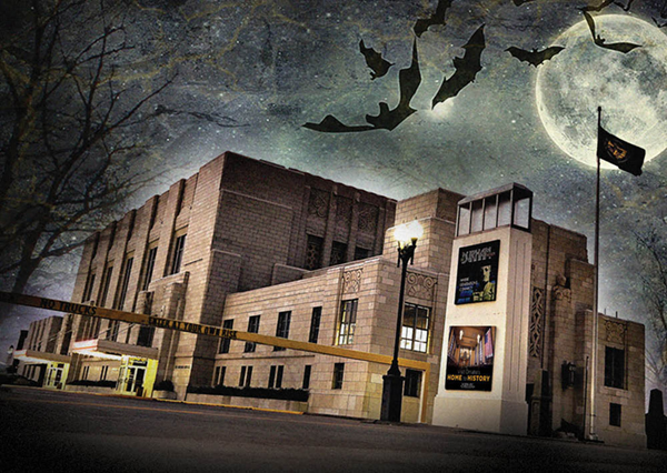 A spooky looking Union Station at night with a full moon and bats flying in the background
