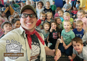 A group of kids being entertained by Ranger Anthony