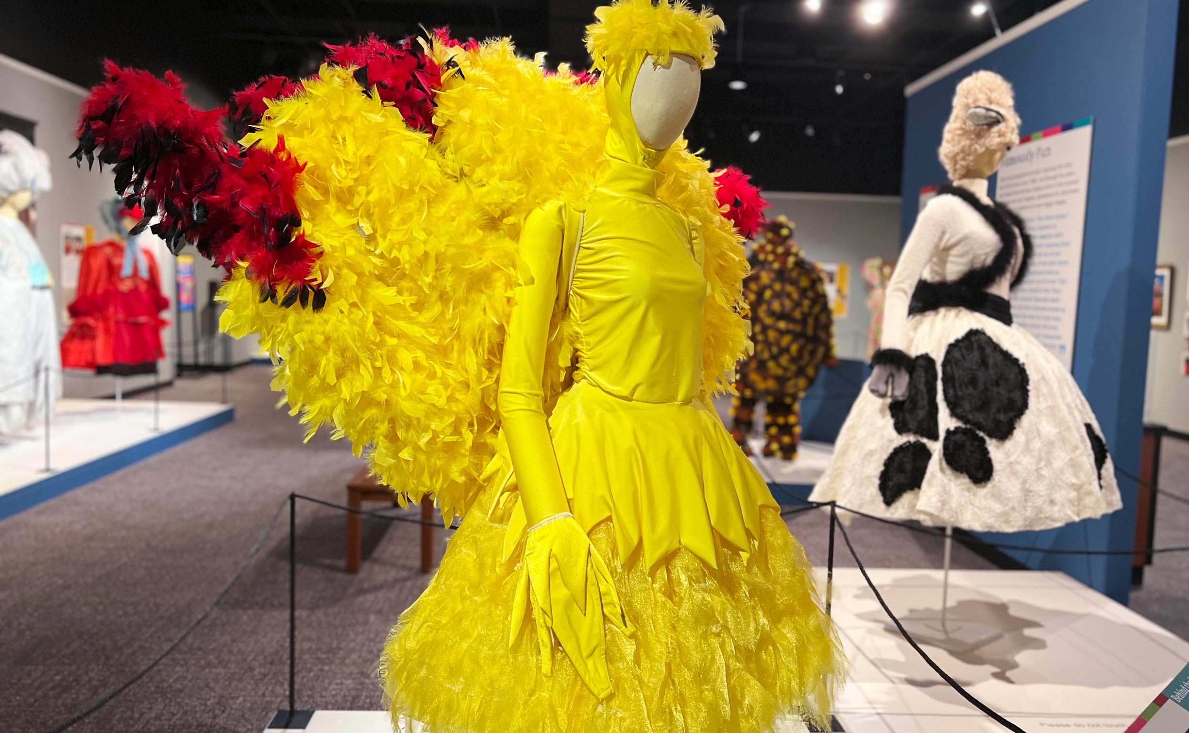 A mannequin is dressed in a yellow feathered costume designed by Sherri Geerdes