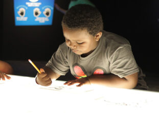 Kid at tracing table